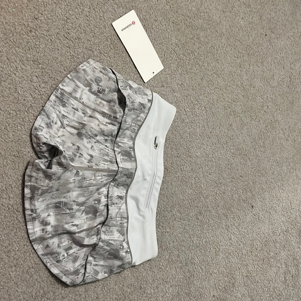 Grey and white Lululemon shorts never worn size 2 brand new with tags